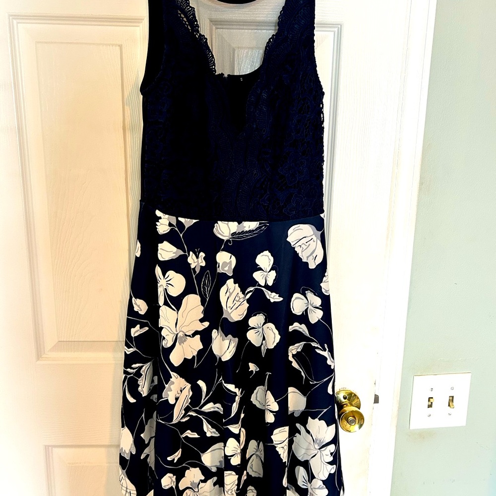 Blue and white with shear neck and laced top. Worn once